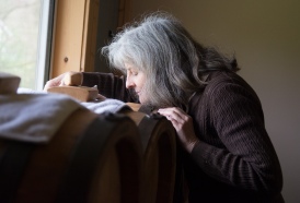 Vintner and vinegar producer Marilyn Schulze takes in the smell of balsalmic vinegar at her family's farm.